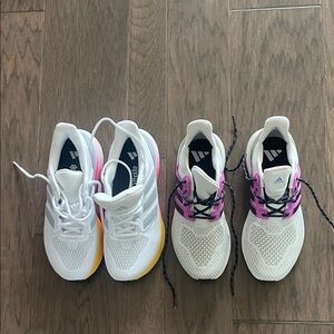 Two pairs of women’s adidas tennis shoes